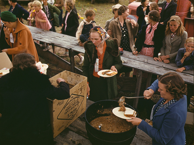 1940 photo of a group serving pinto beans